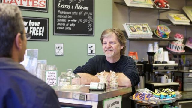 Jack Phillips - behind counter, smiling